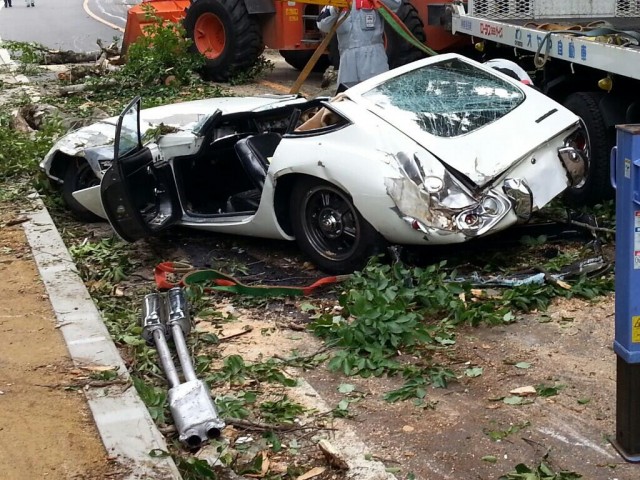With Perfect Timing A Toyota 2000GT Is Crushed By A Tree