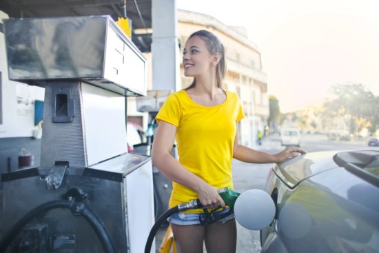 Girl at gas pump
